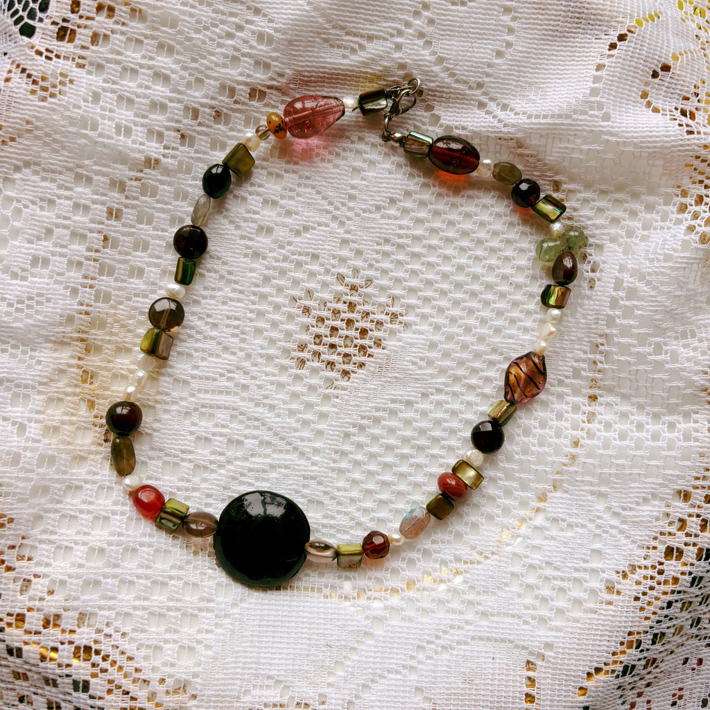 Beaded necklace on a lace doily